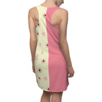 back view of model wearing the chic and feminine dress that features a unique design that combines a beautiful floral pattern with pink accents. The right side of the dress is a lovely shade of pink, while the left side showcases a captivating floral print with pink flowers and stars on a charming beige background.