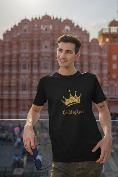 black t-shirt featuring gold crown words Child-of-God on a man