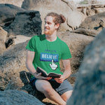 Man reading book with blue believe button short-sleeve t-shirt in green white finger clicking and John 3:16 above