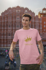 pink t-shirt featuring gold crown words Child-of-God on a man