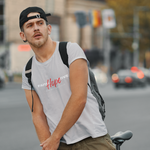 Man wearing grey t-shirt with words faith and love in white and hope in red