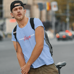 Man wearing blue t-shirt with words faith and love in white and hope in red