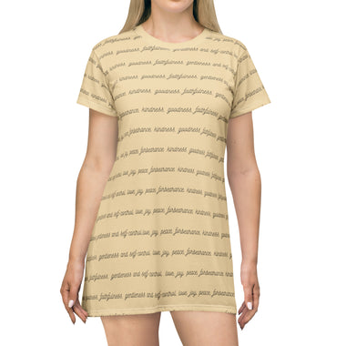 Woman wearing tan shirt sleeve tunic with fruits of the spirit text printed in black cursive writing - front view